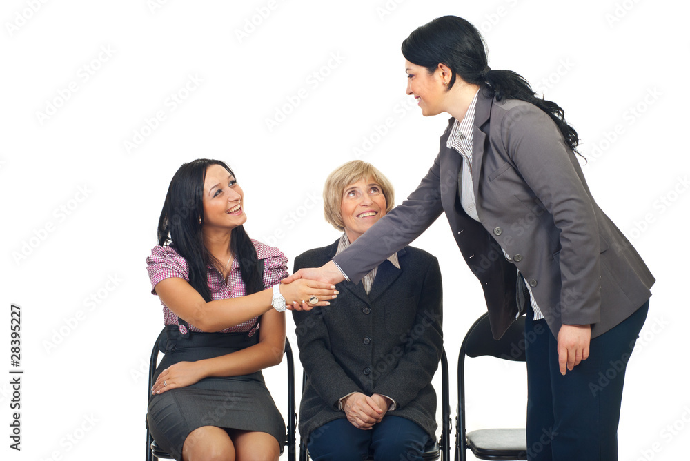 Obraz premium Business woman congratulate her colleague