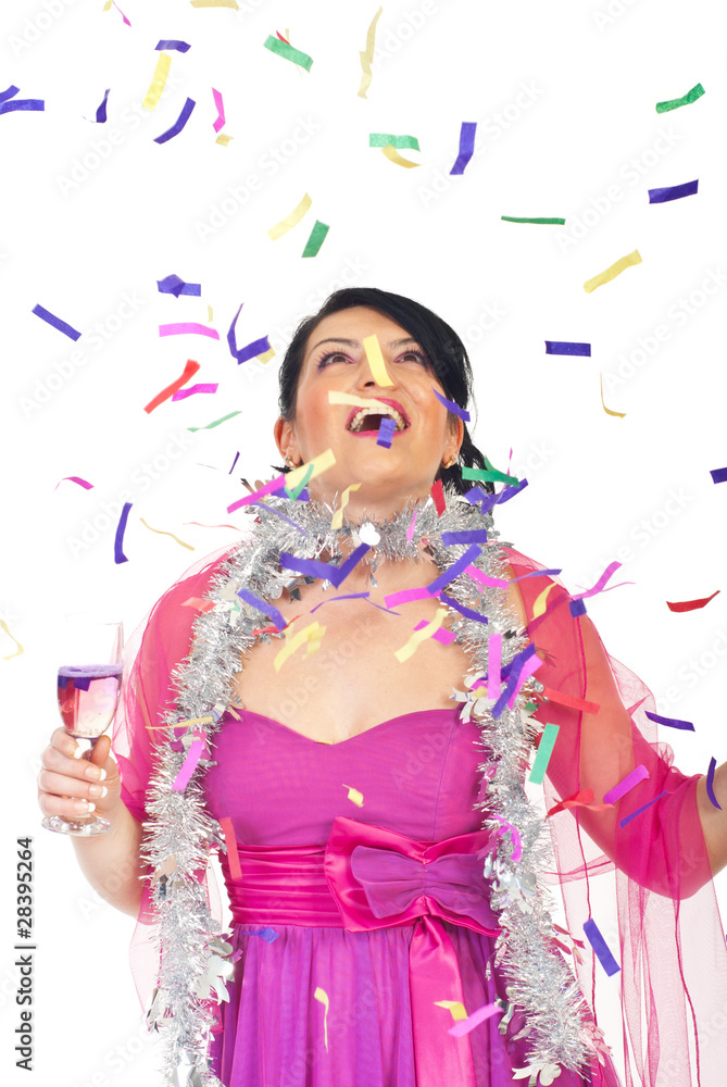 Surprised woman looking up at falling confetti Surprised woman looking up at falling confetti