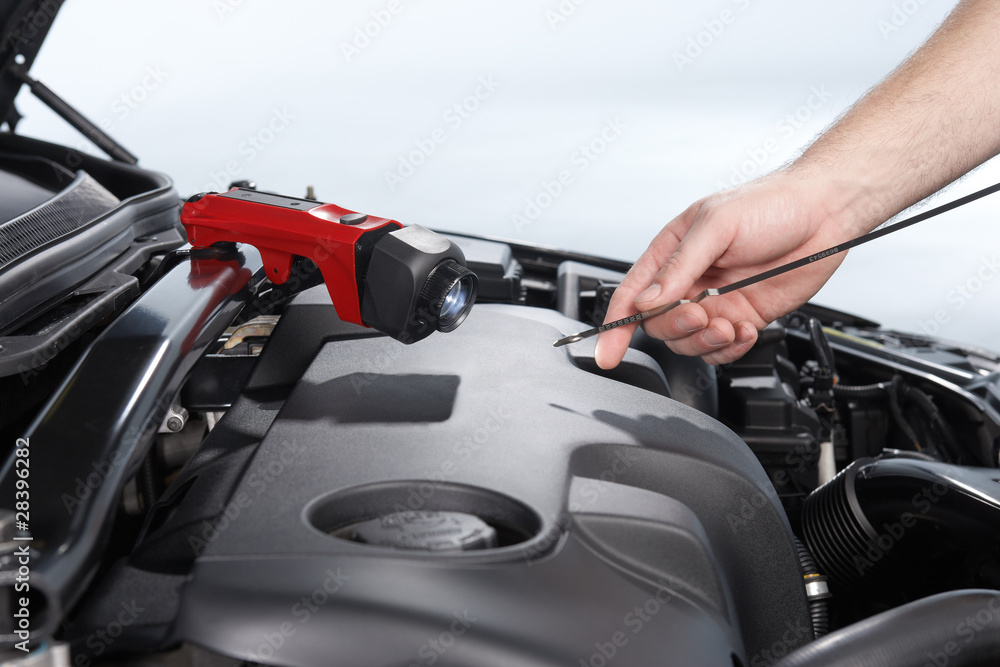 Fototapeta premium checking engine oil