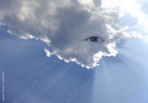 Konstfotografi Big eye in the sky with lot of rays of light through clouds