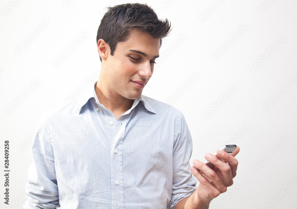 Young businessman looking at his phone Young businessman looking at his phone