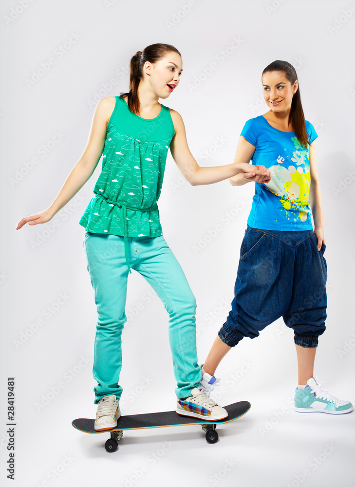 Fototapeta premium girls with skateboard