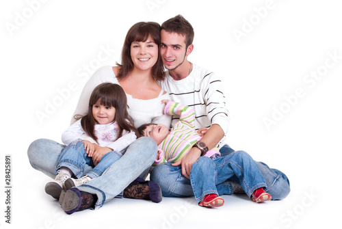 Happiness family with two children isolated on white