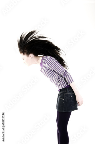 Portrait of a young girl making Mohican hairstyle photo