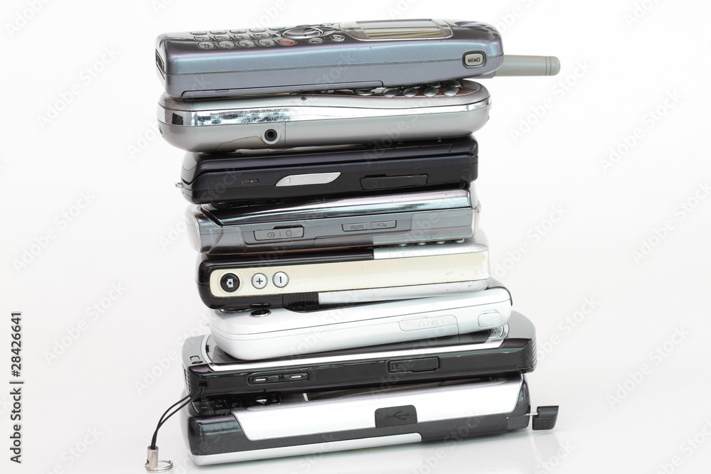Pile of cell phones on white background Pile of cell phones on white background