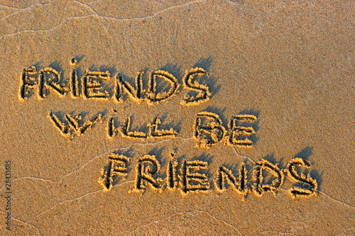 inscription on sand friends will be friends photo