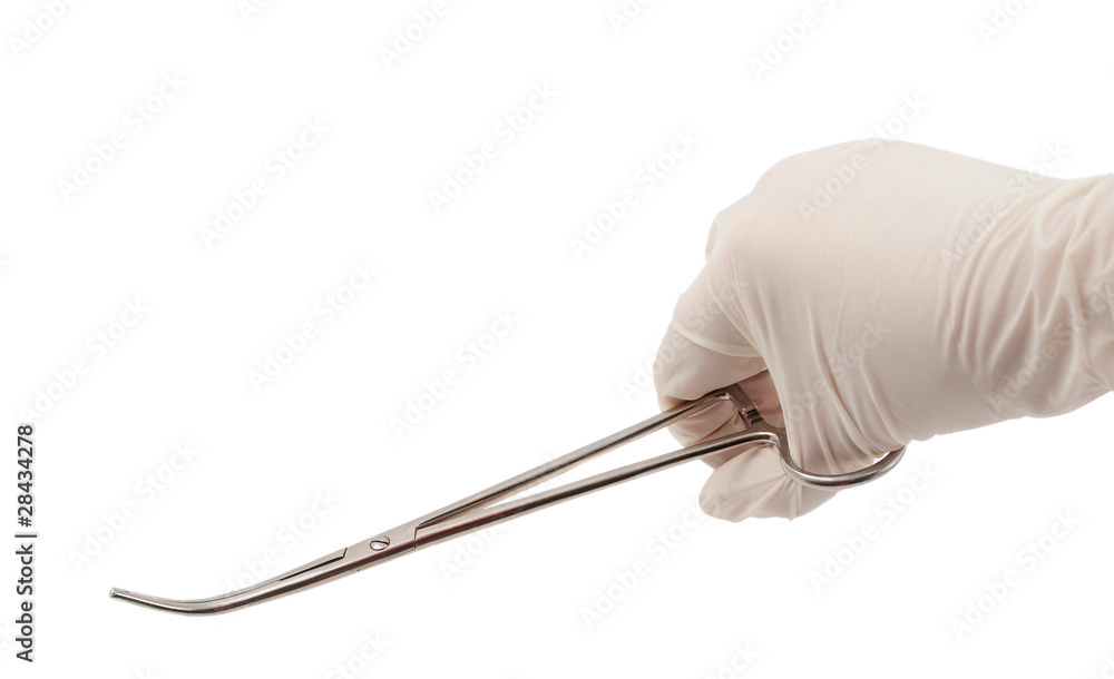 Hand with a surgical instrument Hand with a surgical instrument