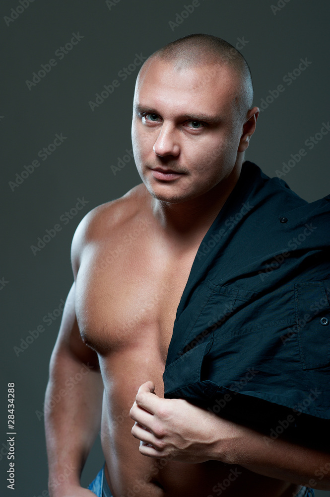 Fototapeta premium Handsome sexy young guy, studio shot