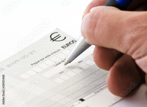 hand signing a check