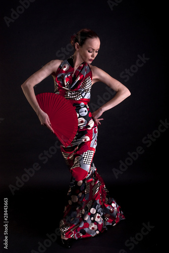 flamenco dancer elegant pose with red fan