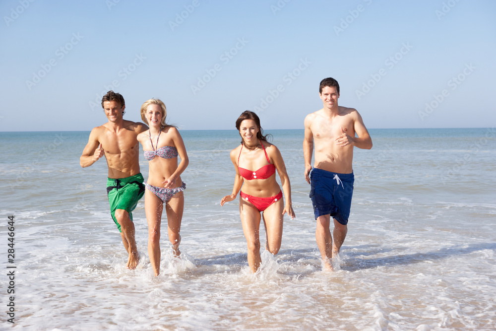 Two young couples on beach holiday Two young couples on beach holiday