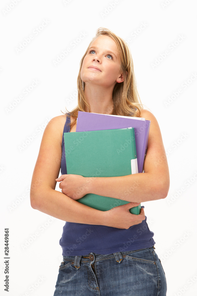 Studio Portrait Of Female Student Holding Folders Studio Portrait Of Female Student Holding Folders