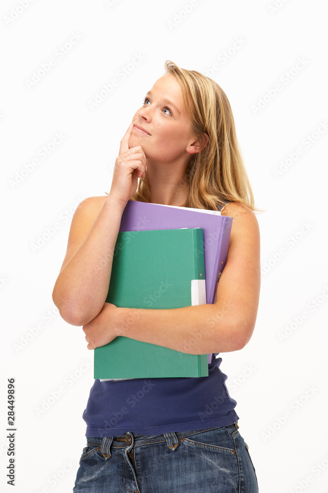 Studio Portrait Of Female Student Holding Folders Studio Portrait Of Female Student Holding Folders