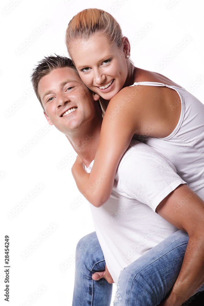 Happy young couple. Isolated over white background.