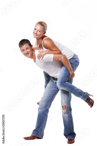 Happy young couple. Isolated over white background.