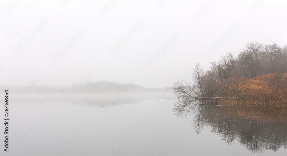 Landing stage in the foggy morning