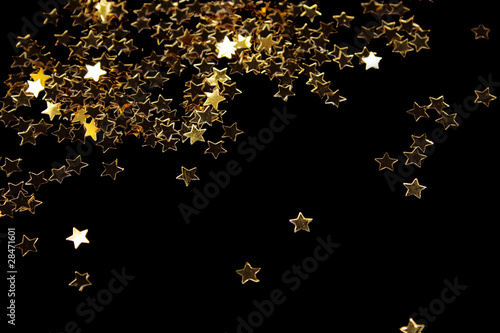 Decoration of golden stars isolated on black