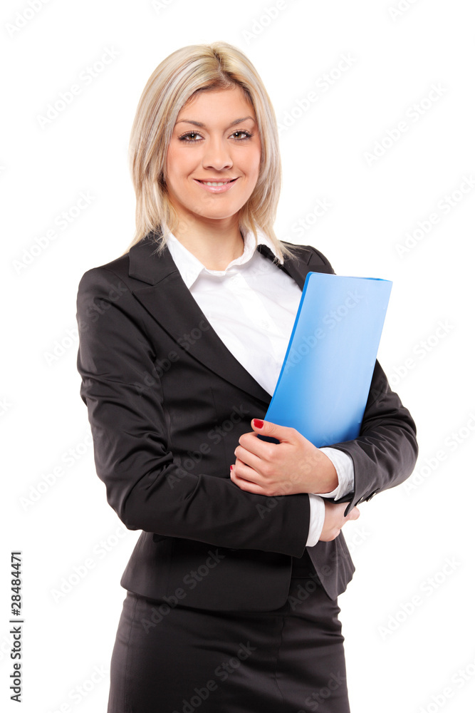 Smiling businesswoman holding a fascicule Smiling businesswoman holding a fascicule