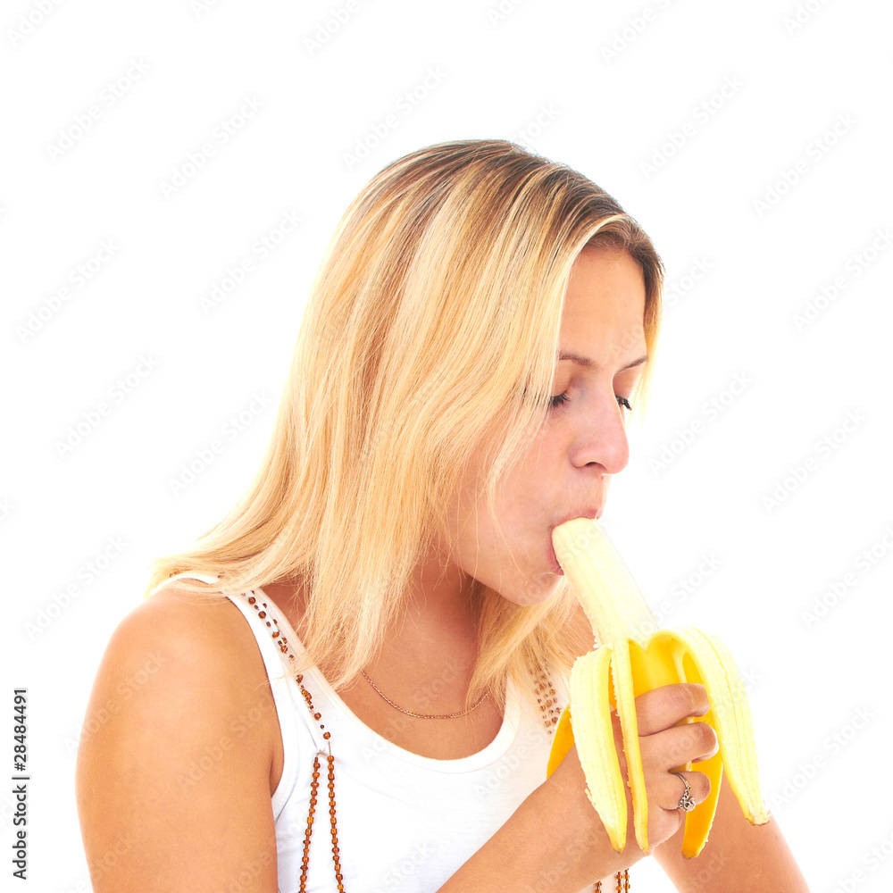 Young woman eating peeled banana Young woman eating peeled banana