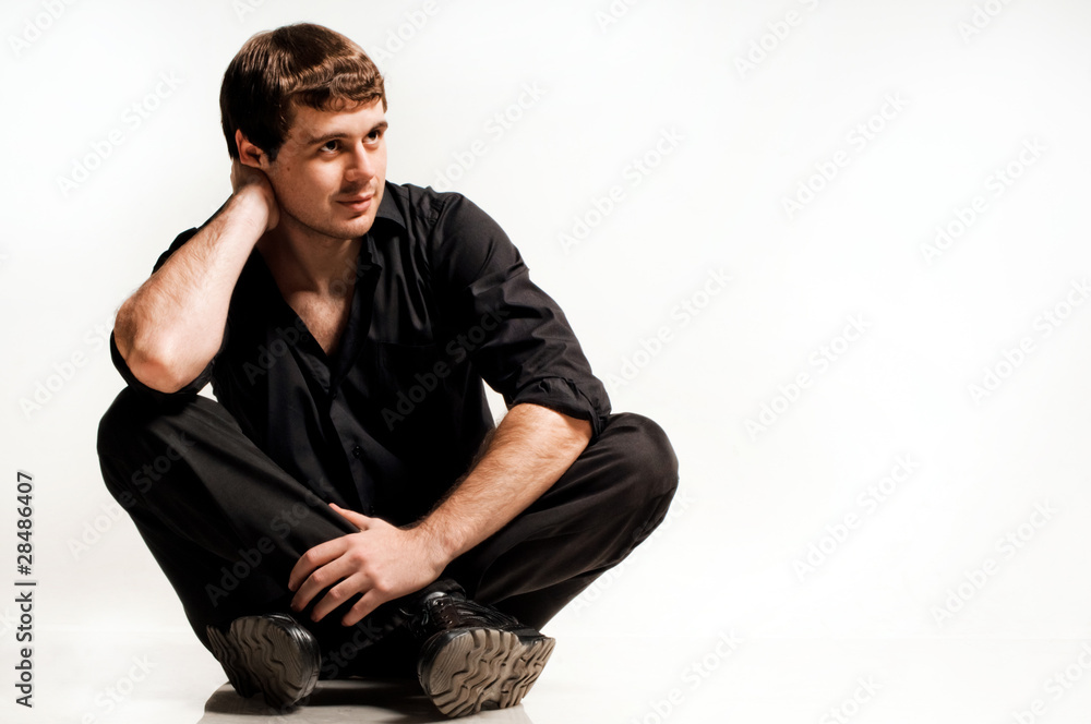 Elegant man in a black shirt, studio portrait Elegant man in a black shirt, studio portrait