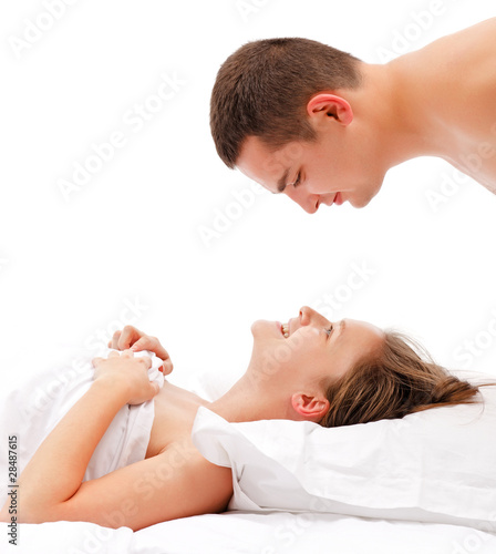 Man bending over woman