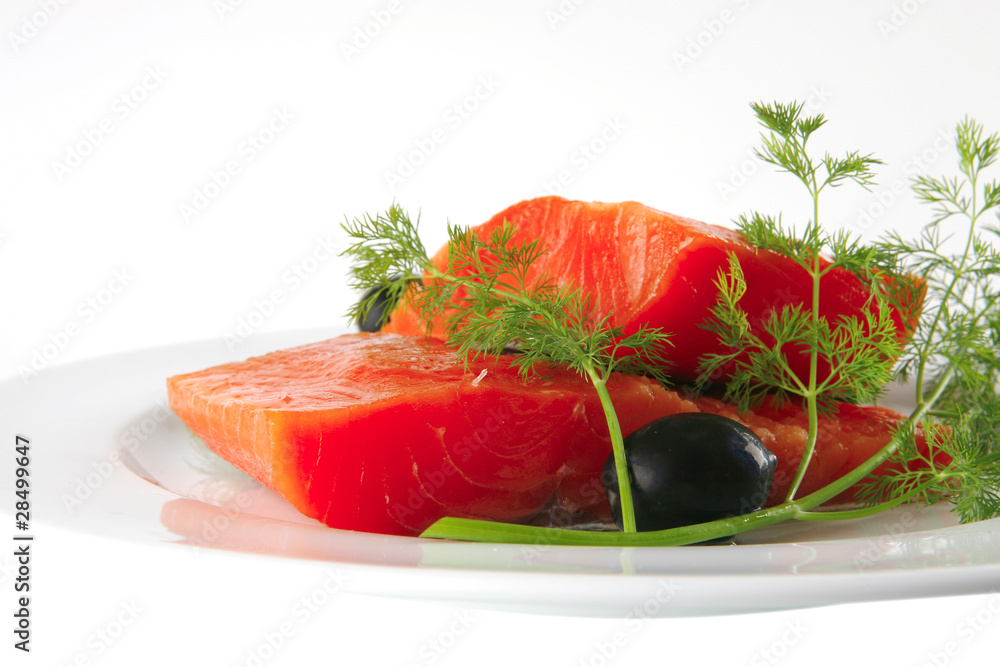 fresh smoked salmon on white plate with olives fresh smoked salmon on white plate with olives