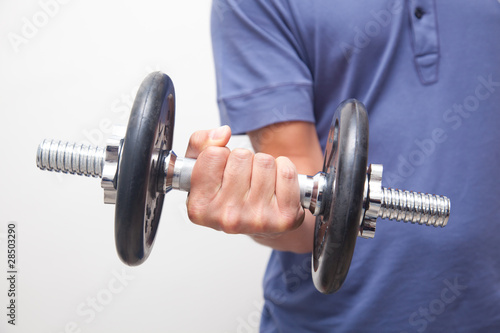 Man contracting biceps while doing some exercises
