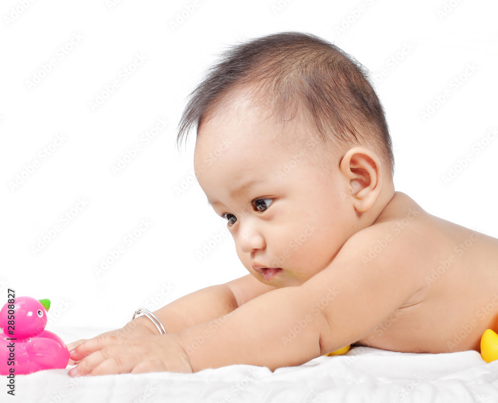 Little funny baby lying on soft bed cover Little funny baby lying on soft bed cover