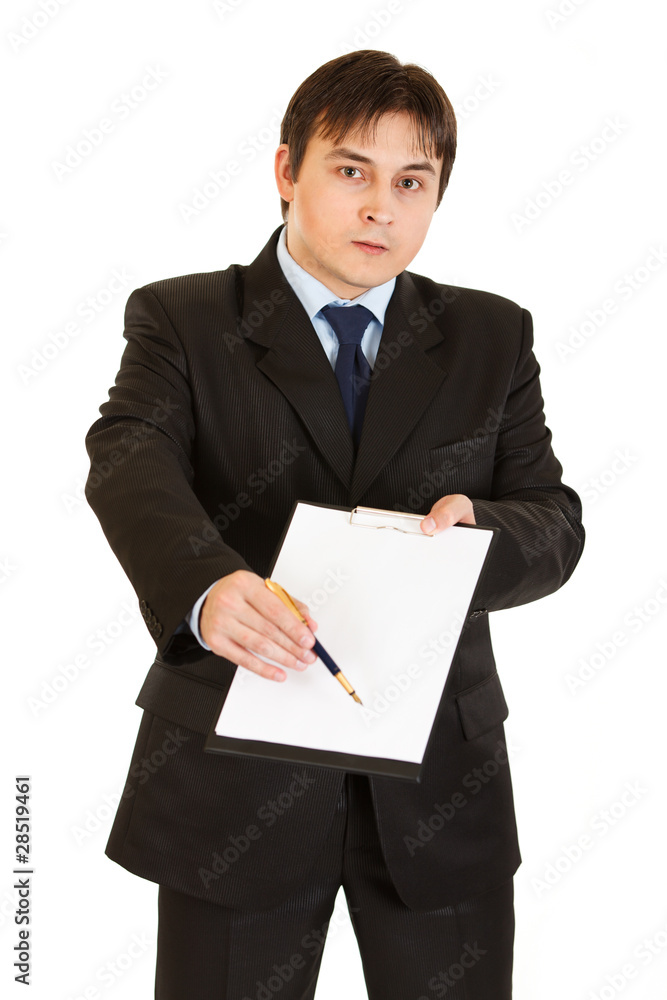 Serious modern businessman with documents for your signing Serious modern businessman with documents for your signing