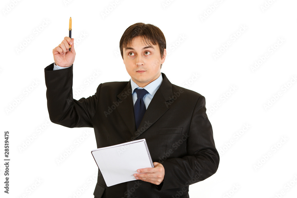 Pensive modern businessman with notebook got idea Pensive modern businessman with notebook got idea