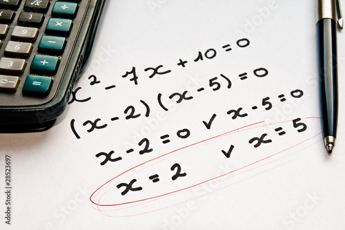 math exercise with calculator and pen