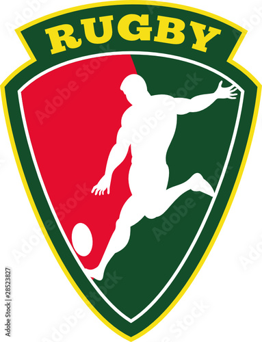 rugby player kicking ball shield