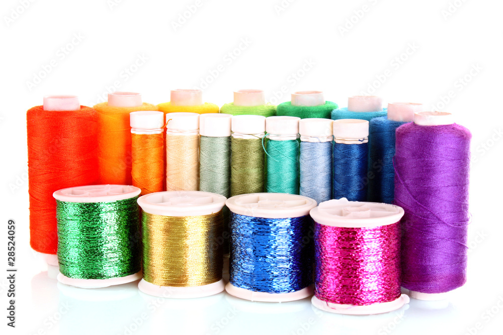 Semicircle of many-coloured bobbins of thread isolated on white Semicircle of many-coloured bobbins of thread isolated on white