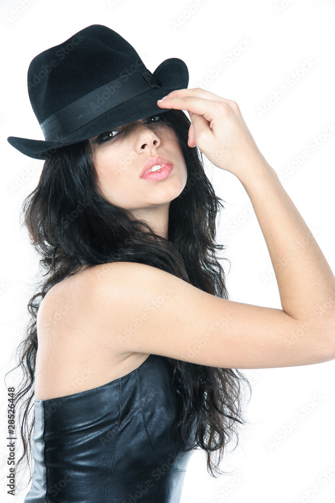 studio portrait of young beautiful woman in black hat over white studio portrait of young beautiful woman in black hat over white