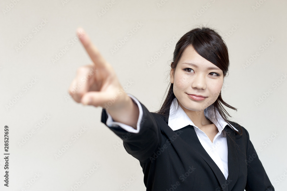 a portrait of young business woman pointing a portrait of young business woman pointing