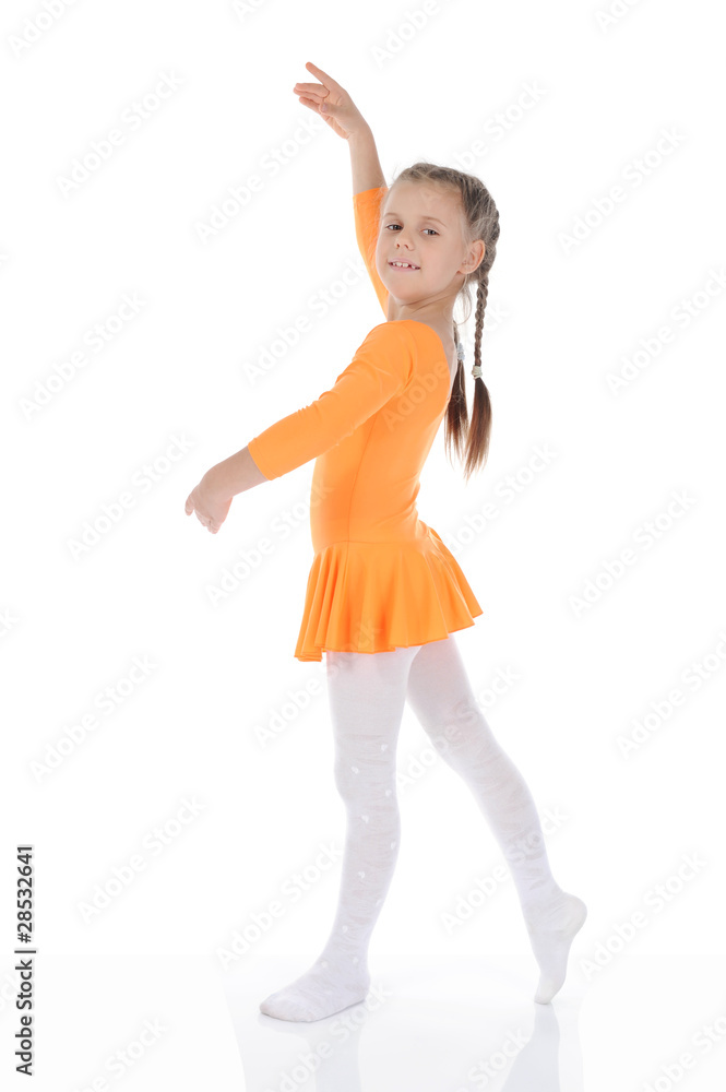 beautiful ballerina dancing in an orange dress. beautiful ballerina dancing in an orange dress.