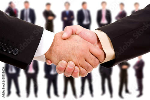 Handshake isolated on business background photo