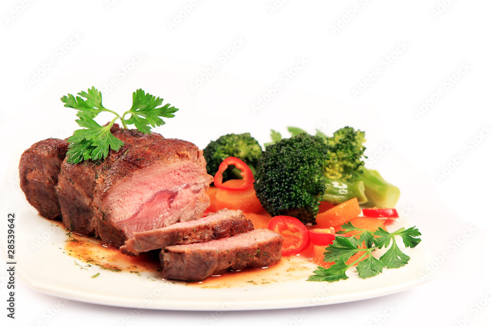 carved roast beef and vegetables