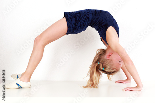 Girl child performing gymnastics