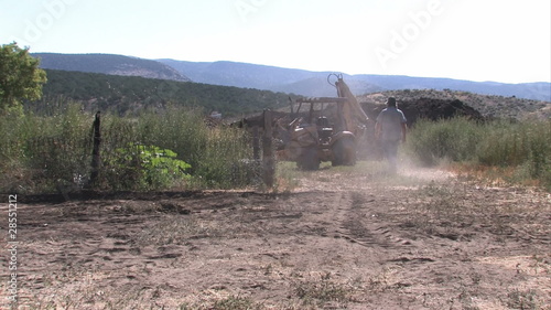 Backhoe man walking M HD photo