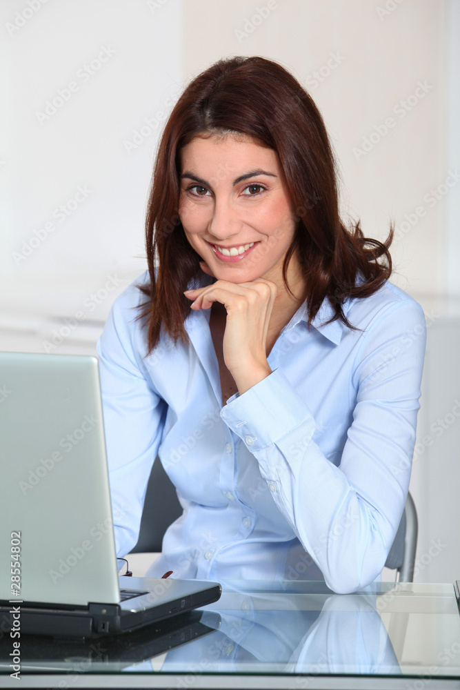 Businesswoman with hand on chin Businesswoman with hand on chin