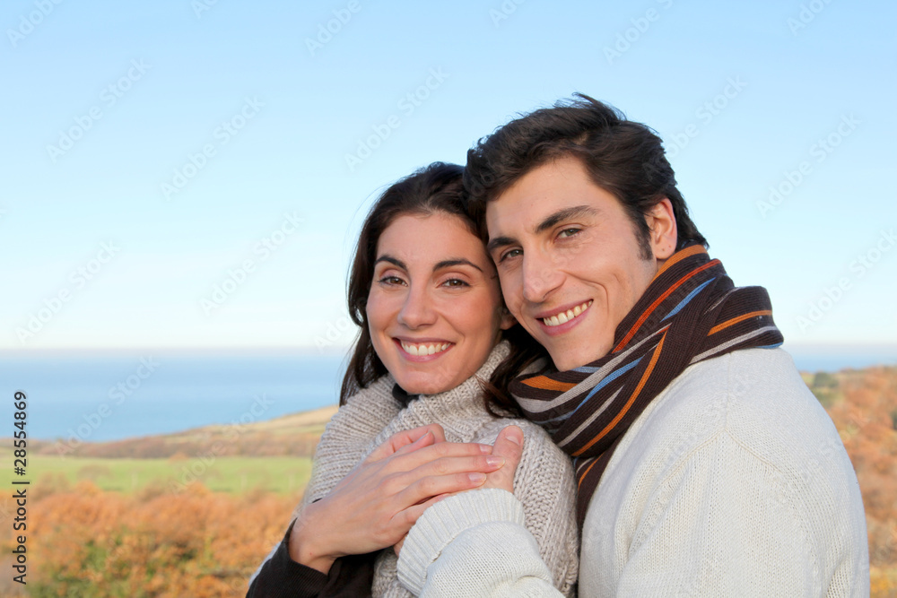 Portrait of happy couple in fall season Portrait of happy couple in fall season