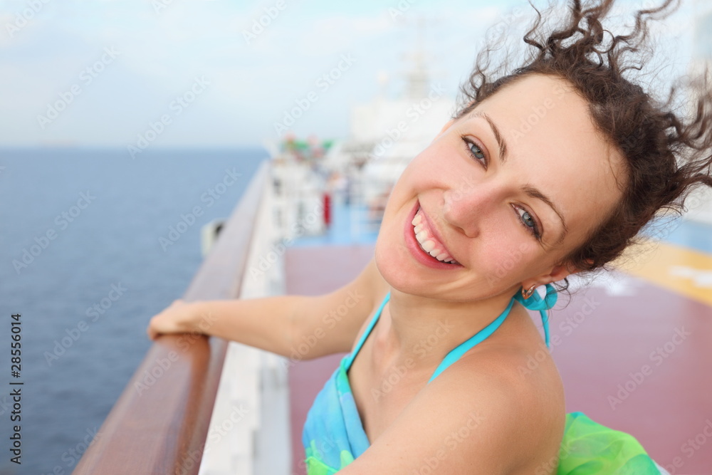 portrait of woman. woman standing on deck of cruise ship.