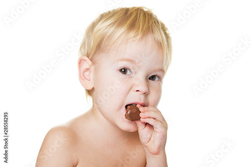 Boy eating chocolate candy
