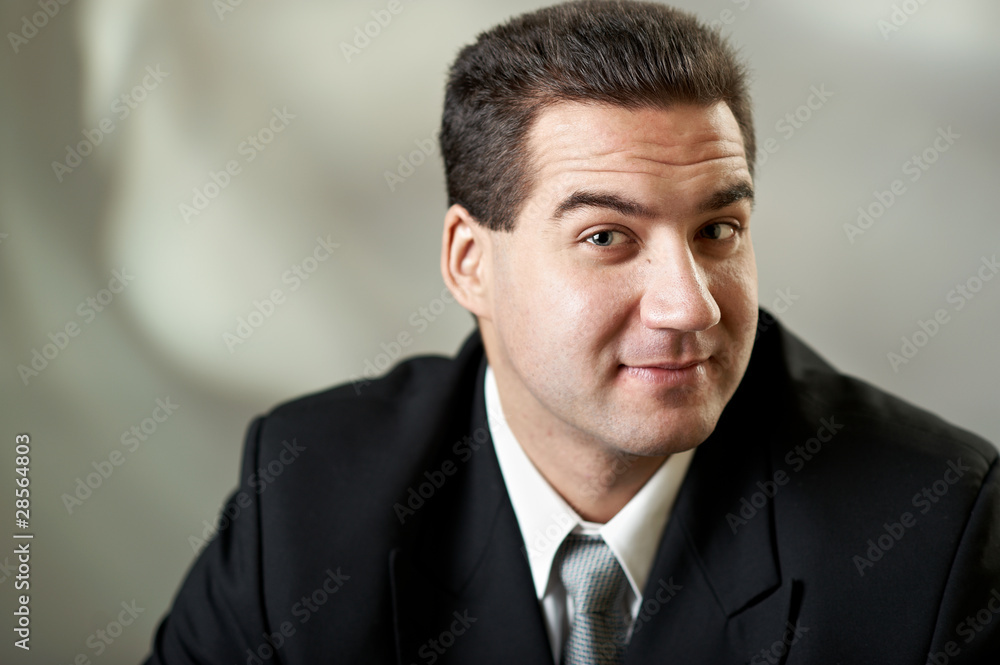 Portrait of attractive businessman in blacksuit Portrait of attractive businessman in blacksuit