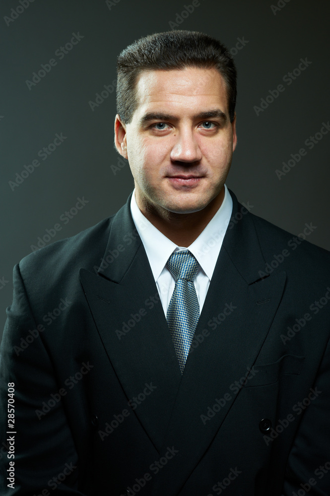 Dark portrait of handsome stylish young man in black suit Dark portrait of handsome stylish young man in black suit