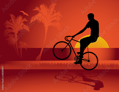 Young man riding a fixed-gear bicycle also called fixie