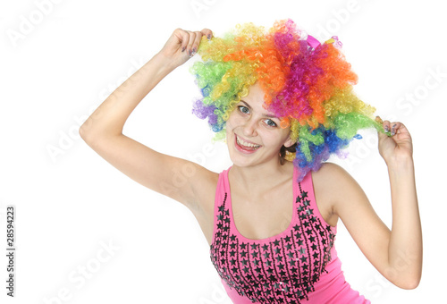 young happy woman in clownish wig over white