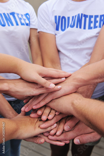 volunteer group hands together