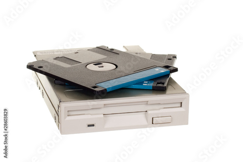 Floppy disk drive with diskettes isolated over white